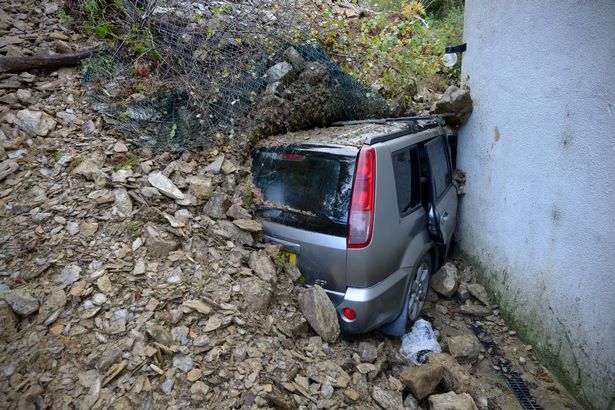 The family car struck by the debris