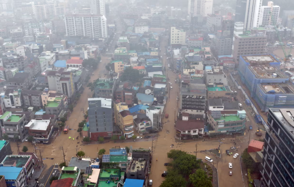 Flooded streets in Geoje, South Gyeongsang province, after torrential rainfall